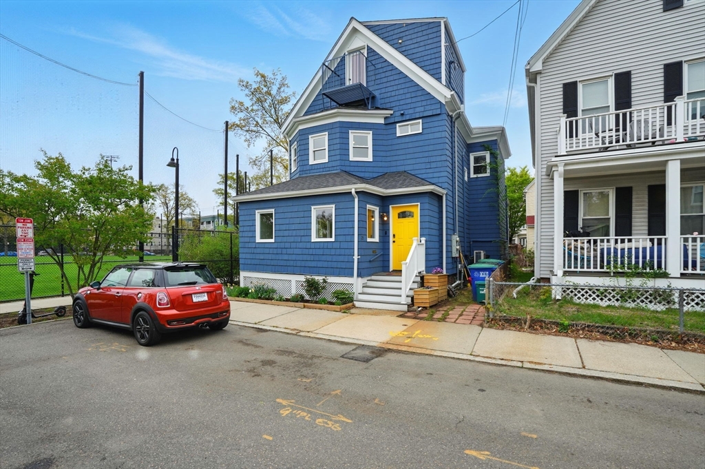 25 Bowdoin Street Somerville, MA 02143 - Photo 2 of 28 a front view of a house with parking area