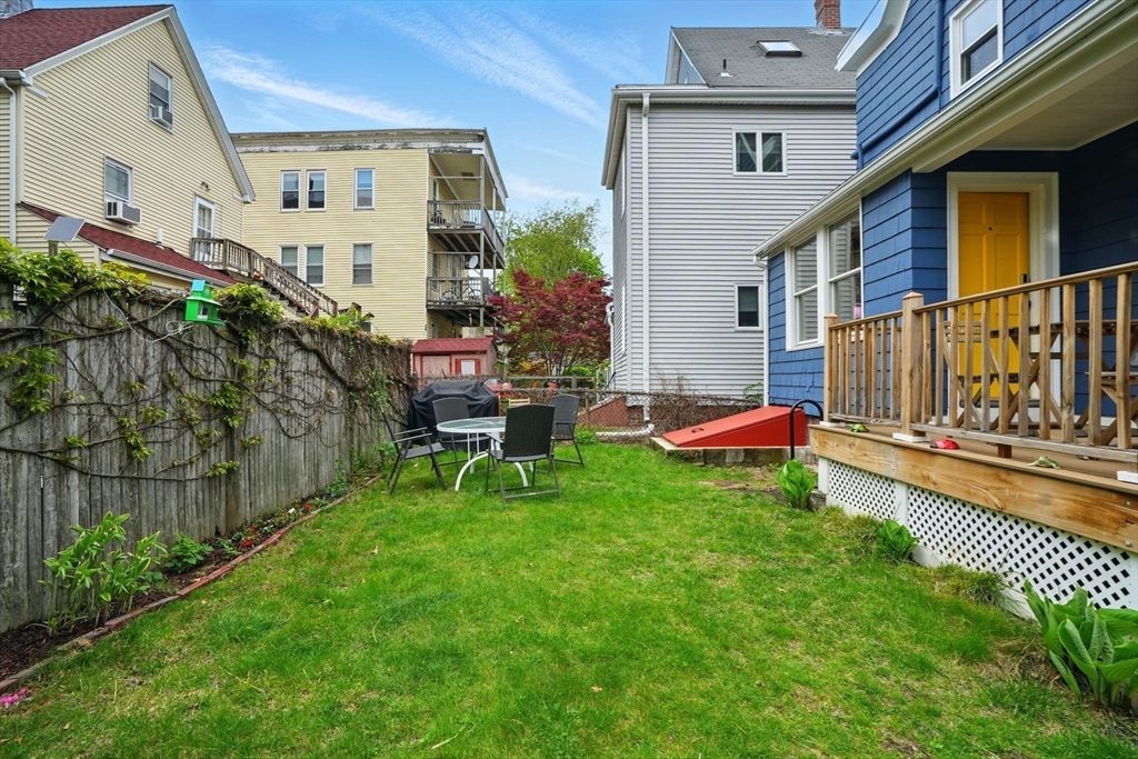 25 Bowdoin Street Somerville, MA 02143 - Photo 23 of 28 a view of a chair and table in backyard of the house