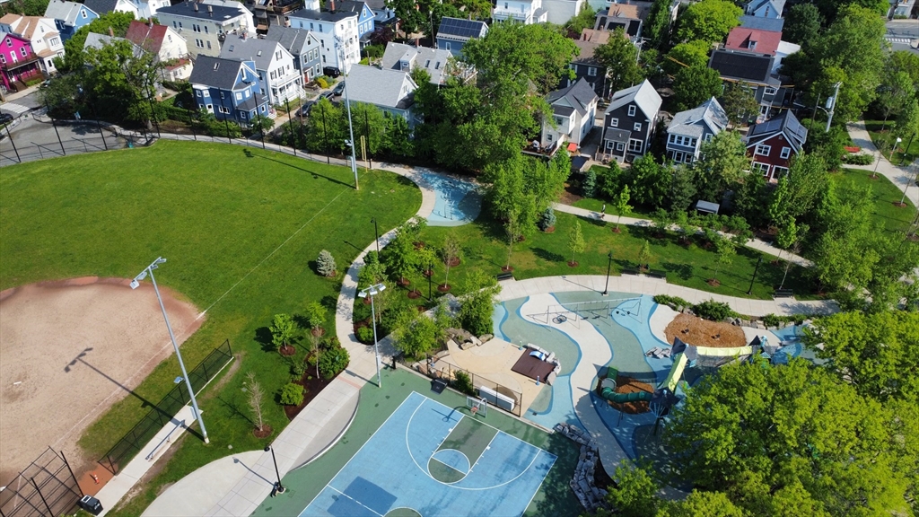 25 Bowdoin Street Somerville, MA 02143 - Photo 28 of 28 an aerial view of a house with a yard and lake