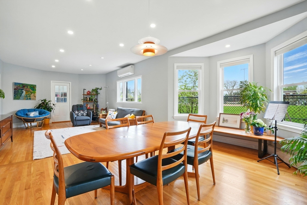 25 Bowdoin Street Somerville, MA 02143 - Photo 6 of 28 a dining room with furniture a window and wooden floor
