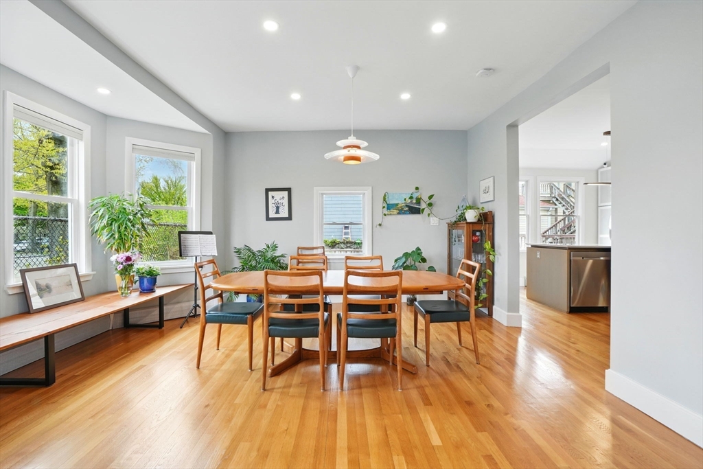 25 Bowdoin Street Somerville, MA 02143 - Photo 7 of 28 a living room with furniture and a wooden floor