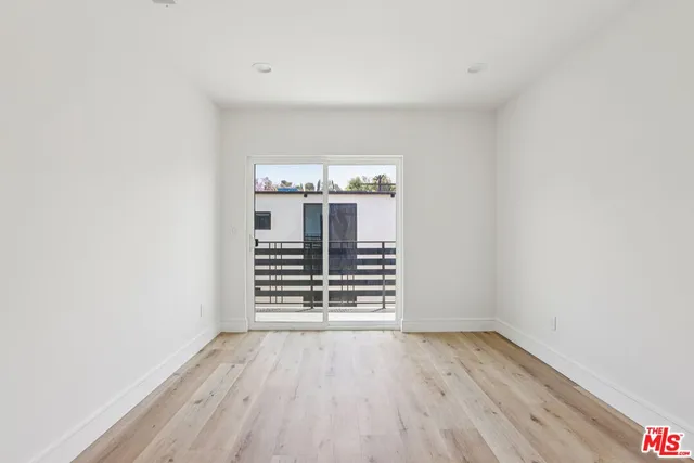 a view of a livingroom with wooden floor