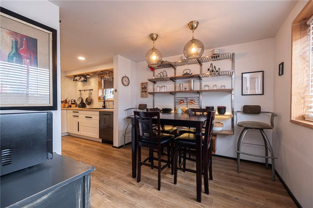 7608 Cheyenne Street Pittsburgh, PA 15218 - Photo 17 of 33 a view of a dining room with furniture and wooden floor