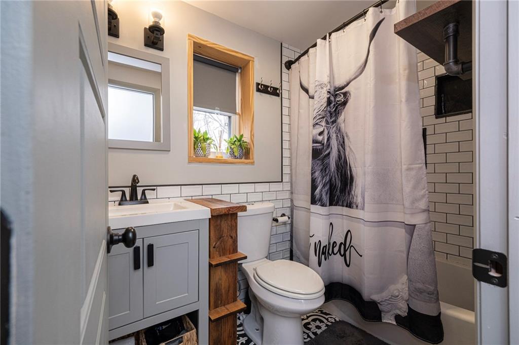 7608 Cheyenne Street Pittsburgh, PA 15218 - Photo 26 of 33 a bathroom with a sink toilet and mirror