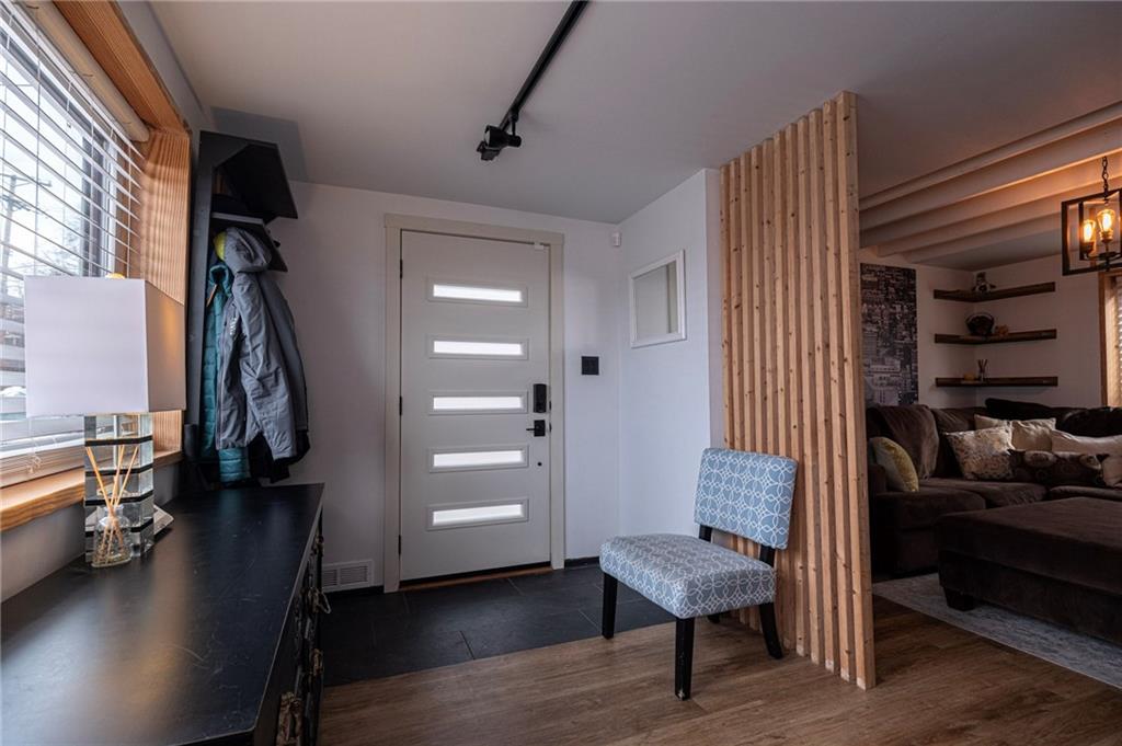 7608 Cheyenne Street Pittsburgh, PA 15218 - Photo 8 of 33 a view of a room with gym equipment and a window