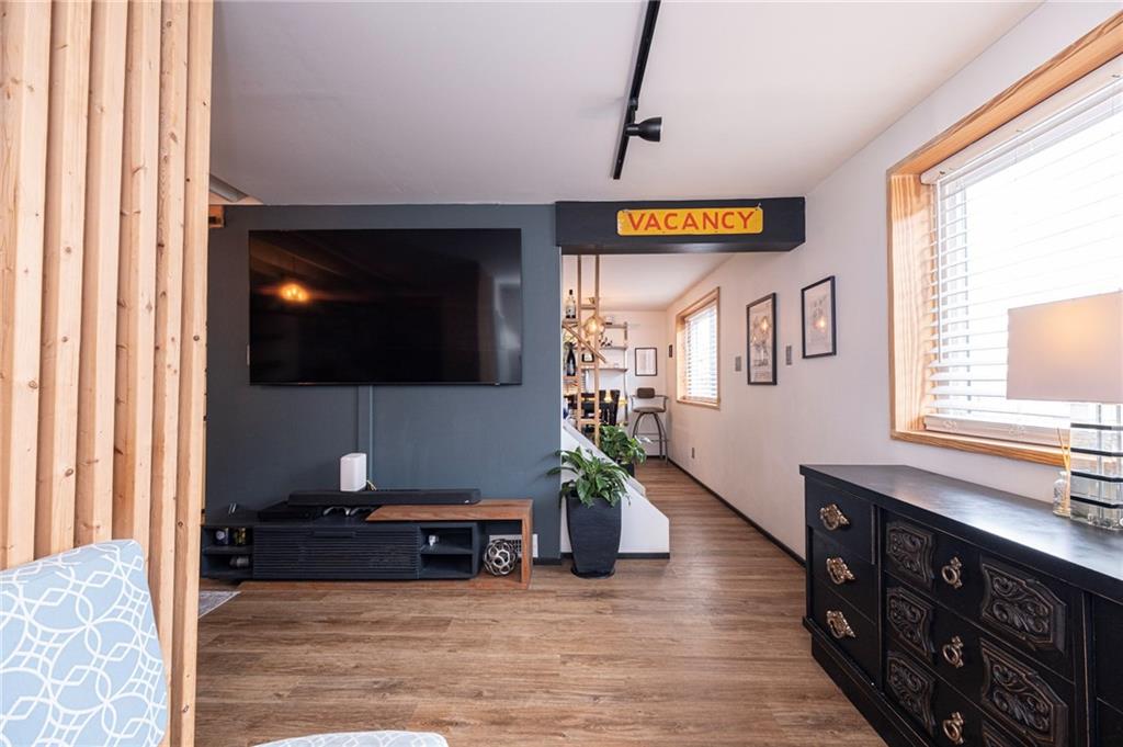 7608 Cheyenne Street Pittsburgh, PA 15218 - Photo 9 of 33 a living room with furniture and a flat screen tv