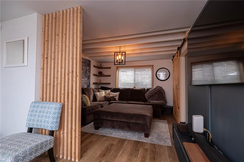 7608 Cheyenne Street Pittsburgh, PA 15218 - Photo 10 of 33 a living room with furniture and a window