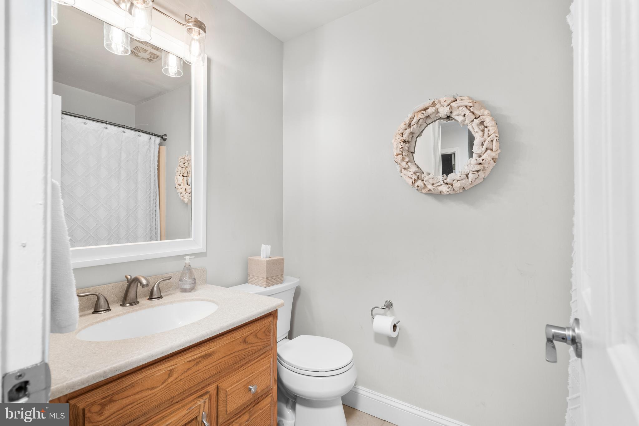 105 South Timber Road Southampton, PA 18966 - Photo 24 of 40 a bathroom with a toilet sink vanity and mirror
