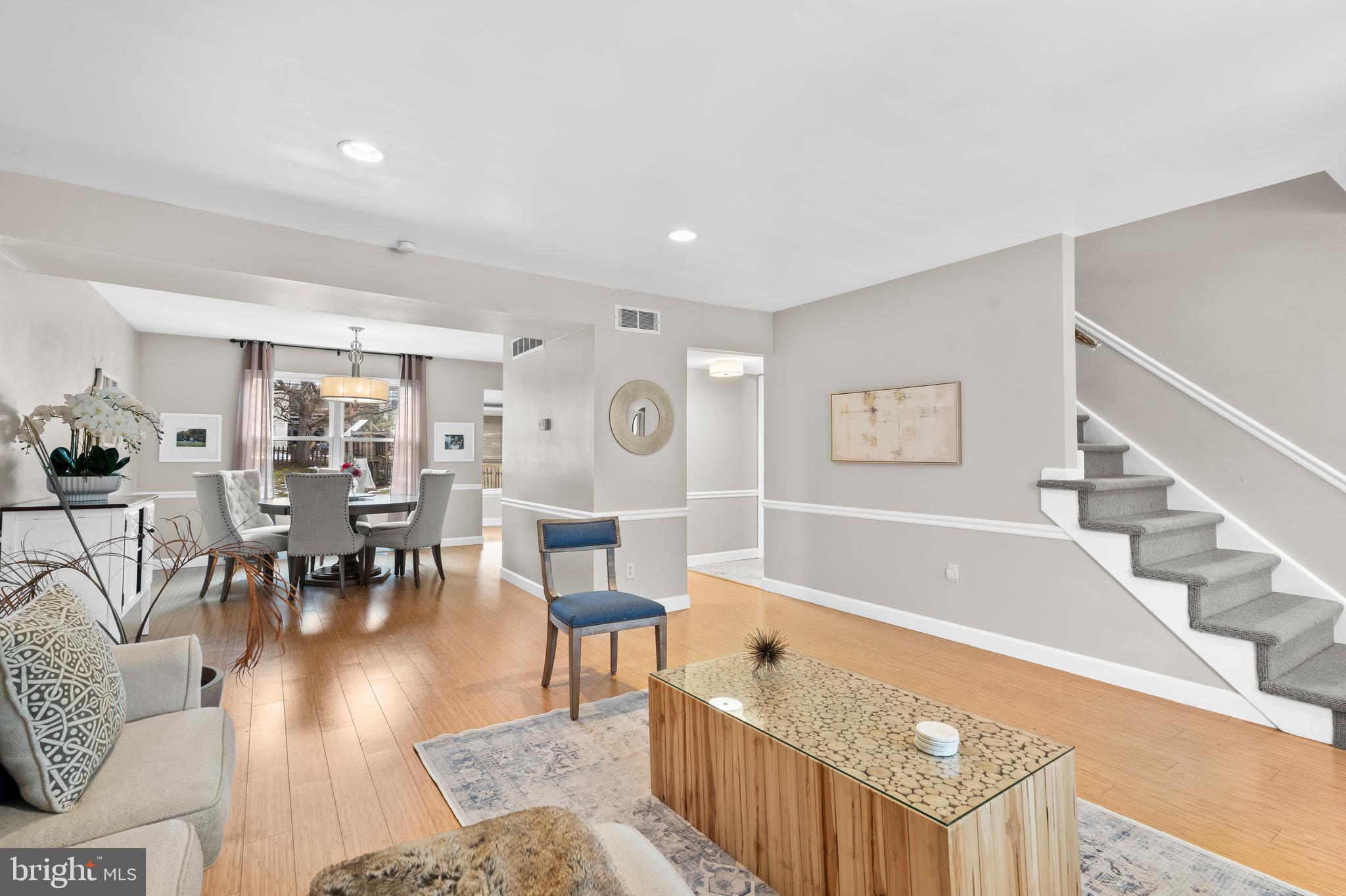105 South Timber Road Southampton, PA 18966 - Photo 4 of 40 a living room with furniture and a dining table with wooden floor