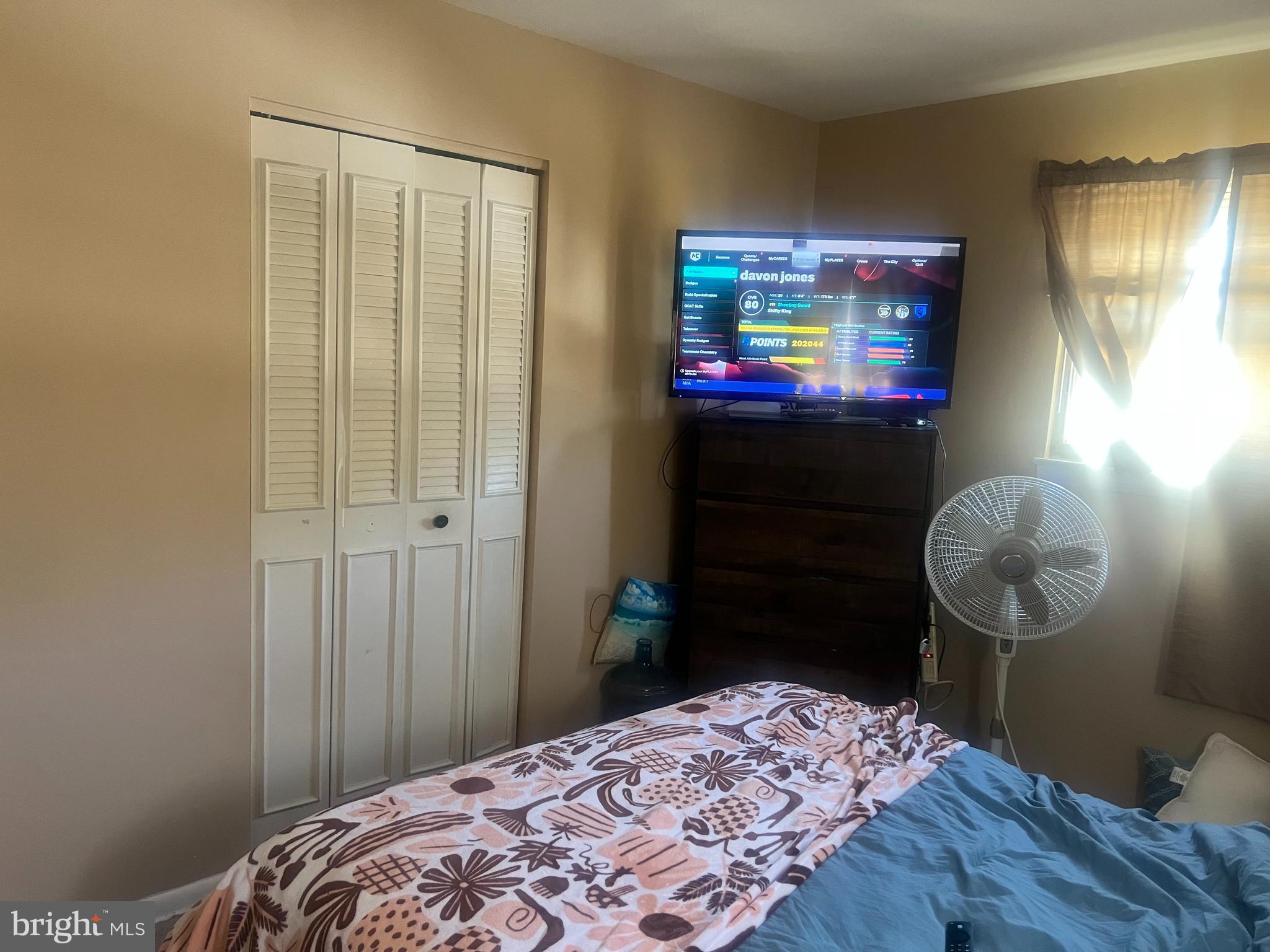 361 Independence Boulevard Lawnside, NJ 08045 - Photo 12 of 14 a bedroom with a bed and a mirror