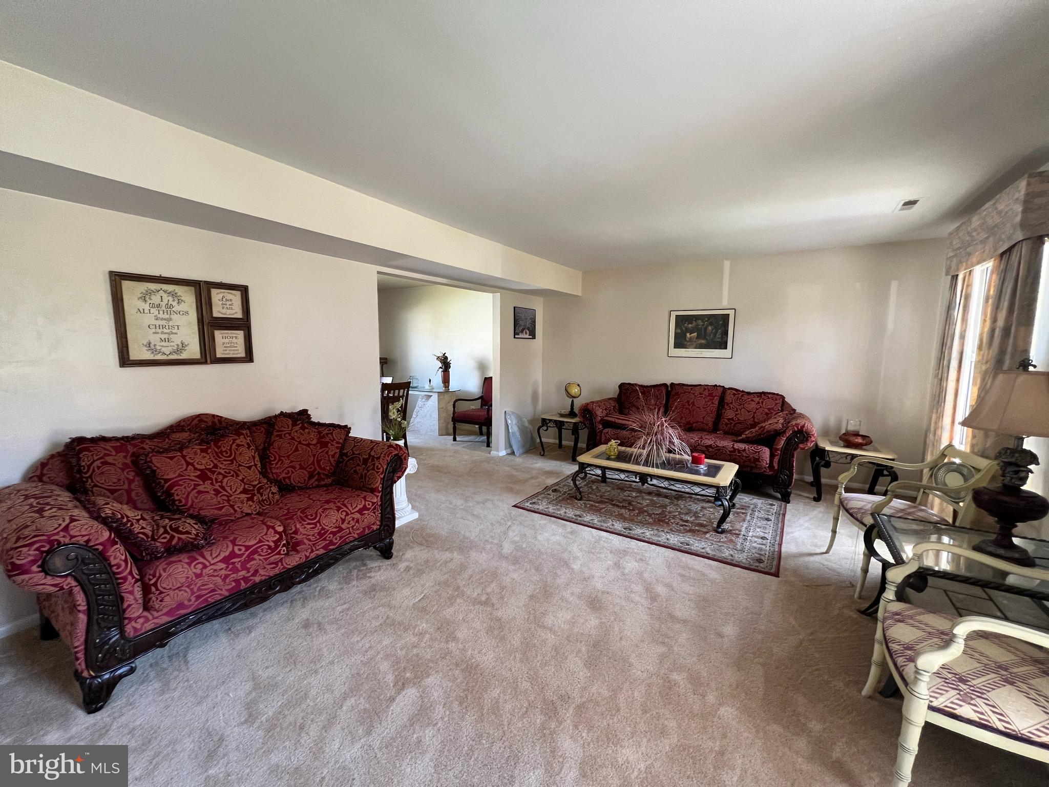 361 Independence Boulevard Lawnside, NJ 08045 - Photo 4 of 14 a living room with furniture a couch and a window