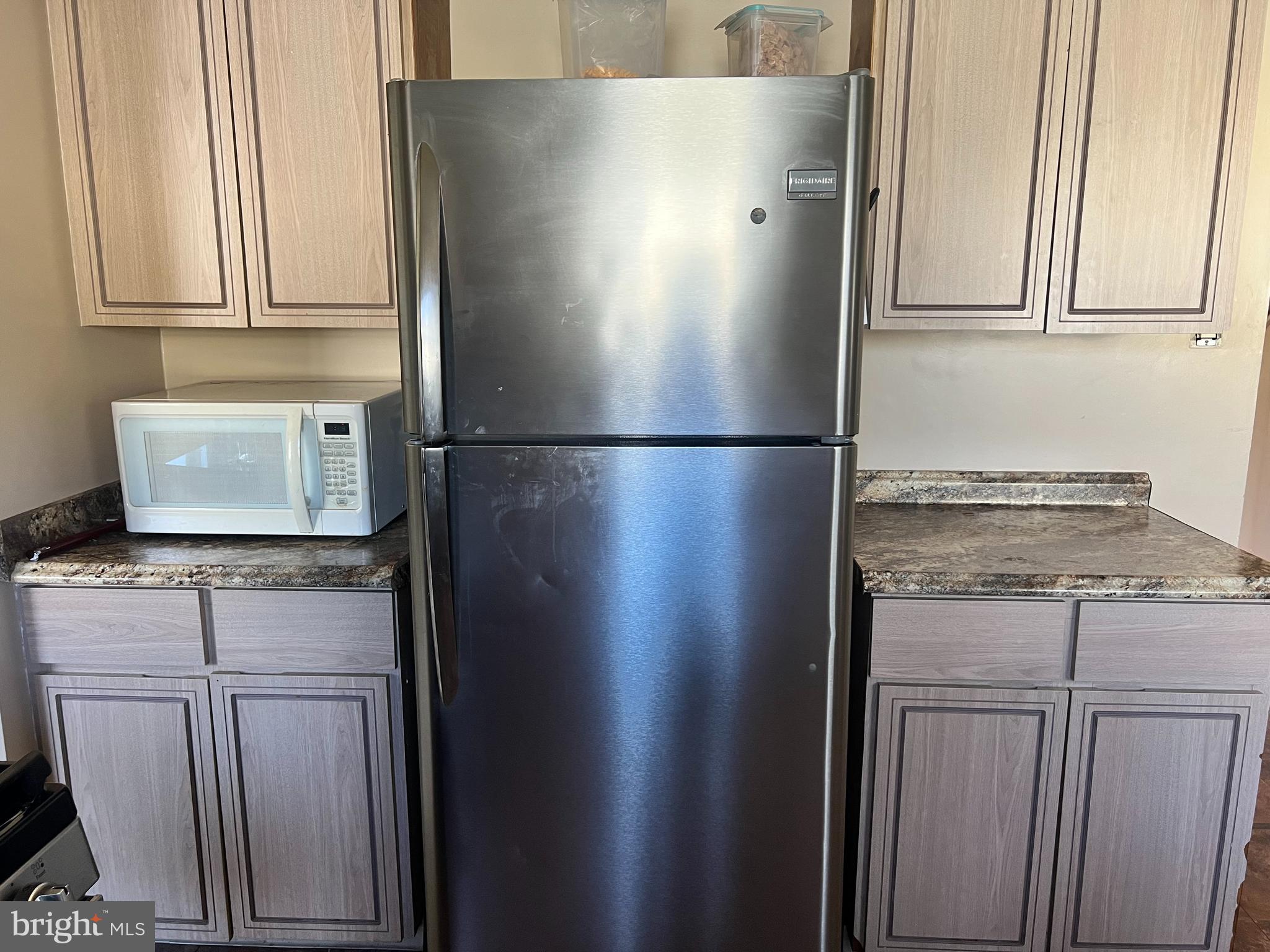 361 Independence Boulevard Lawnside, NJ 08045 - Photo 7 of 14 a white refrigerator freezer sitting inside of a kitchen