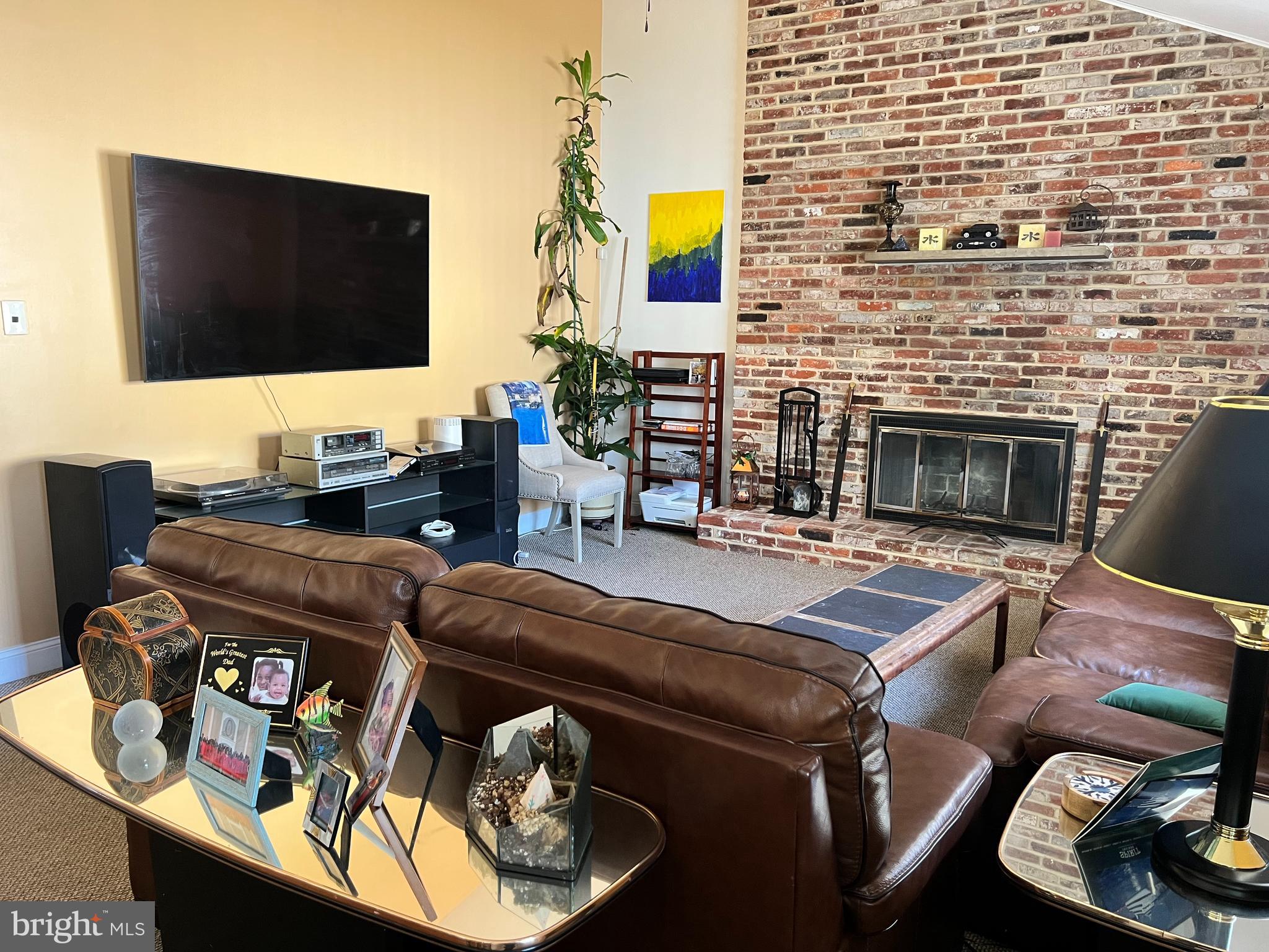 361 Independence Boulevard Lawnside, NJ 08045 - Photo 8 of 14 a living room with fireplace furniture and a flat screen tv