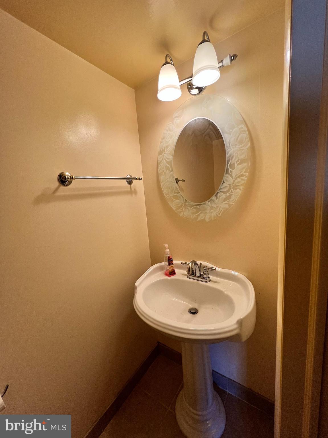 361 Independence Boulevard Lawnside, NJ 08045 - Photo 9 of 14 a bathroom with a sink and mirror