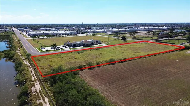 an aerial view of a swimming pool and an outdoor seating