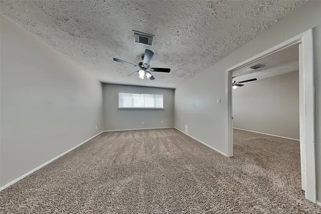 an empty room with a empty space and windows