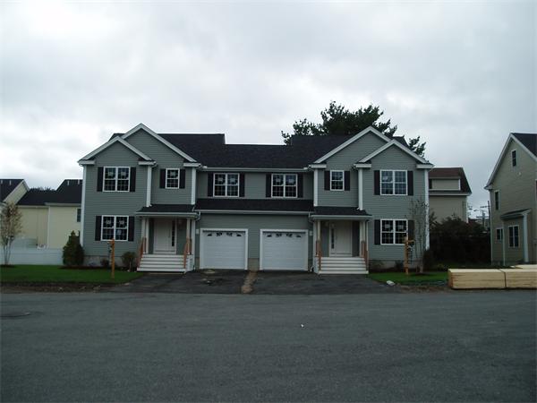 6 Blue Jay Circle, Unit 2 Wakefield, MA 01880 - Photo 1 of 17 a front view of a house with a garden