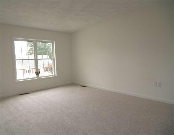 6 Blue Jay Circle, Unit 2 Wakefield, MA 01880 - Photo 14 of 17 an empty room with a window