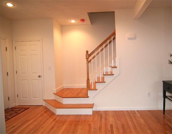 6 Blue Jay Circle, Unit 2 Wakefield, MA 01880 - Photo 2 of 17 a view of entryway with wooden floor and stairs