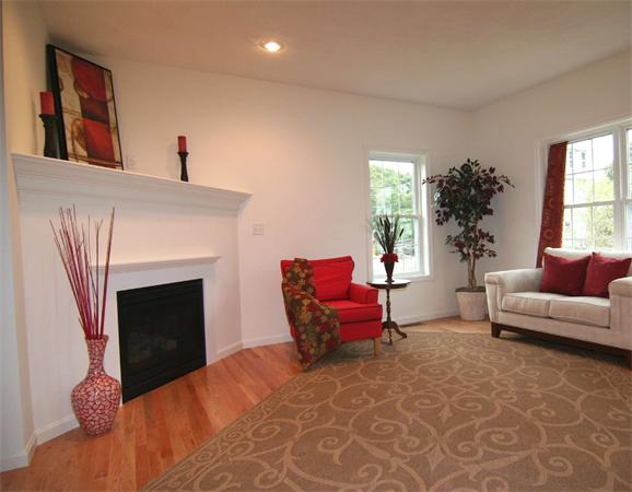 6 Blue Jay Circle, Unit 2 Wakefield, MA 01880 - Photo 5 of 17 a living room with furniture and a fireplace