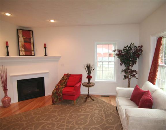 6 Blue Jay Circle, Unit 2 Wakefield, MA 01880 - Photo 6 of 17 a living room with furniture and a fireplace