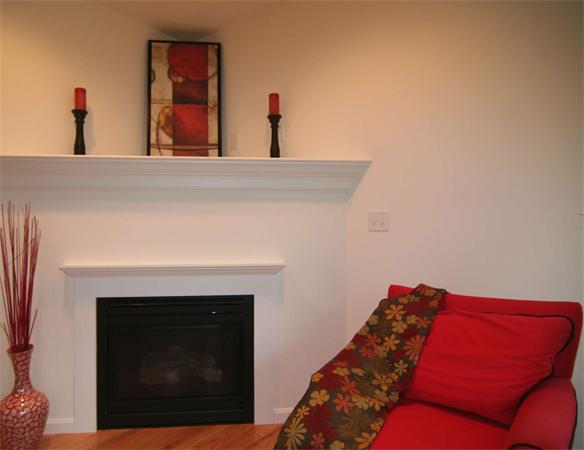 6 Blue Jay Circle, Unit 2 Wakefield, MA 01880 - Photo 7 of 17 a living room with furniture and a fireplace