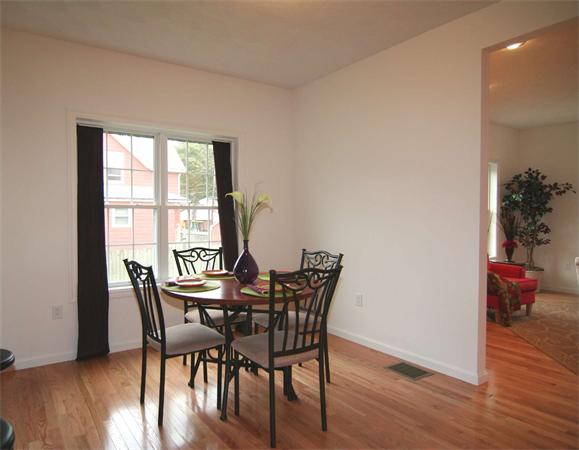 6 Blue Jay Circle, Unit 2 Wakefield, MA 01880 - Photo 8 of 17 a view of a dining room with furniture window and wooden floor