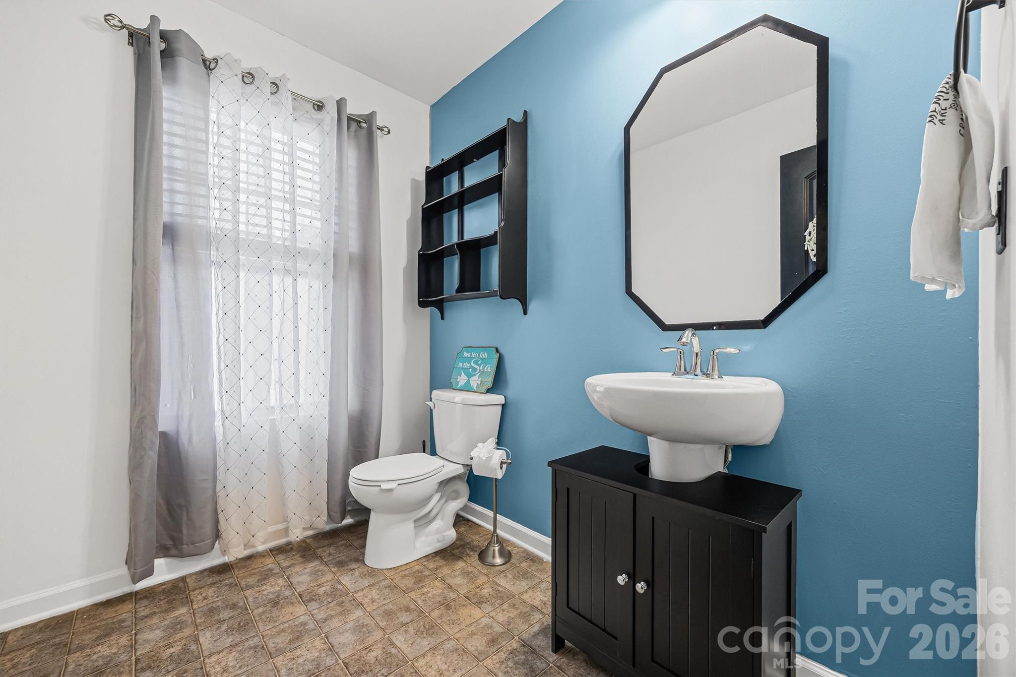 831 Yale Street, Unit 30 Rock Hill, SC 29730 - Photo 28 of 30 a bathroom with a toilet sink and mirror