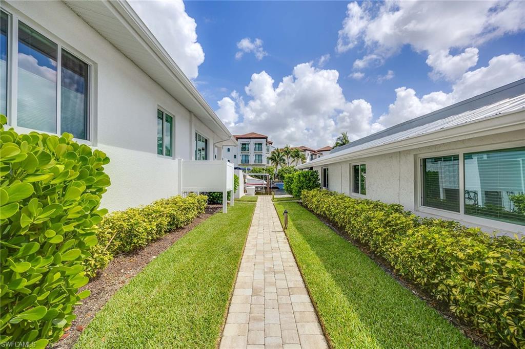 1395 Curlew Avenue, Unit 43 Naples, FL 34102 - Photo 20 of 24 a view of a house with brick walls