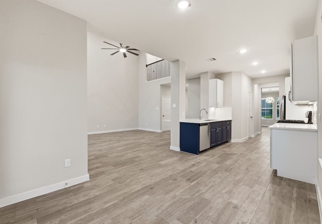 2415 Inlet Court Fresno, TX 77545 - Photo 14 of 50 a view of an empty room with kitchen and a window