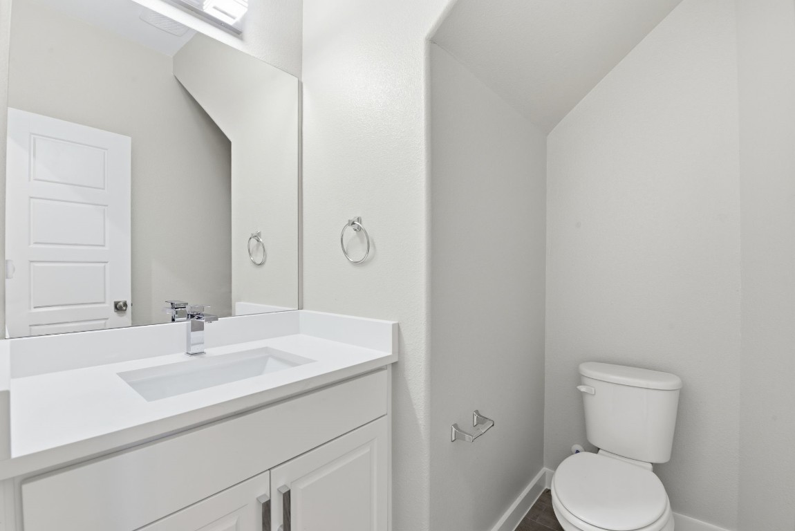 2415 Inlet Court Fresno, TX 77545 - Photo 21 of 50 a bathroom with a sink toilet and vanity