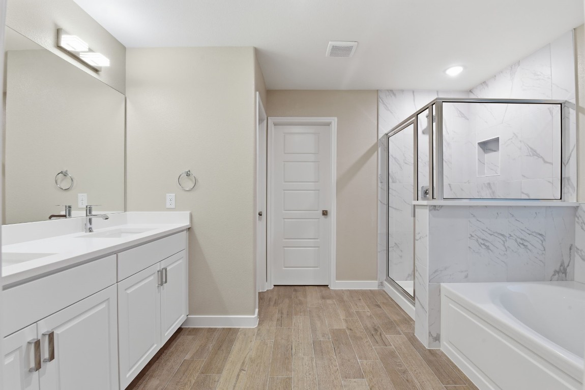 2415 Inlet Court Fresno, TX 77545 - Photo 29 of 50 a bathroom with a tub sink and mirror