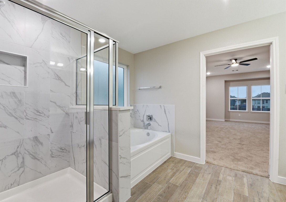 2415 Inlet Court Fresno, TX 77545 - Photo 31 of 50 a bathroom with a bathtub and a shower