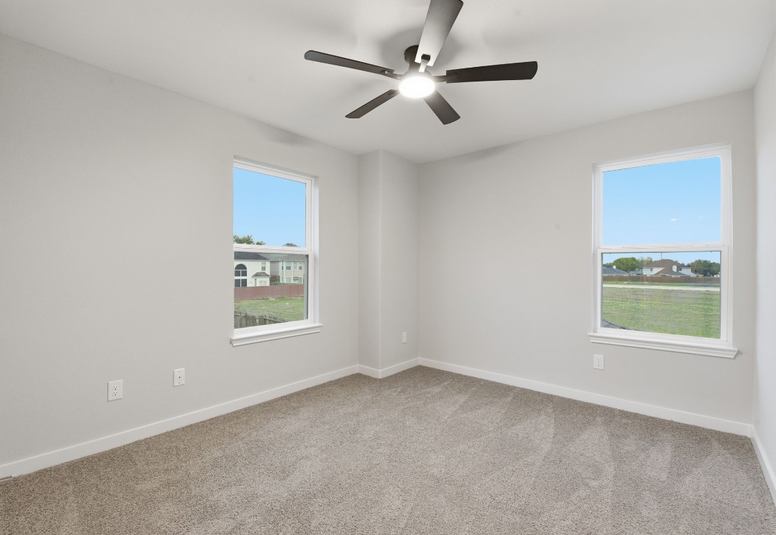 2415 Inlet Court Fresno, TX 77545 - Photo 34 of 50 an empty room with a window and a fan