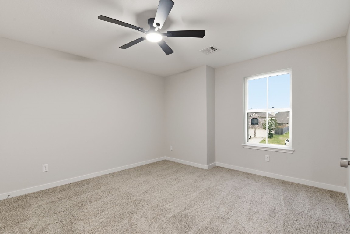 2415 Inlet Court Fresno, TX 77545 - Photo 36 of 50 an empty room with a window and a fan