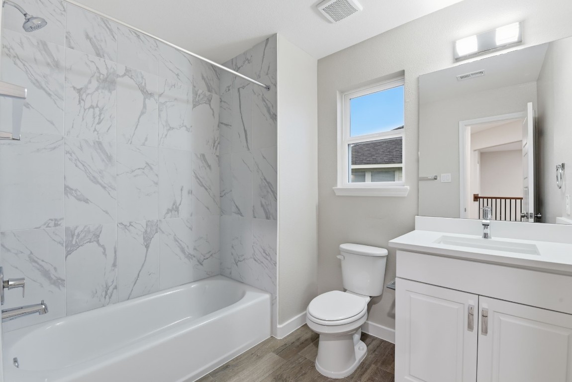2415 Inlet Court Fresno, TX 77545 - Photo 38 of 50 a bathroom with a sink a toilet and shower