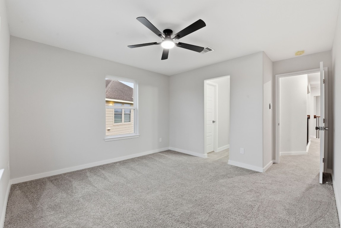 2415 Inlet Court Fresno, TX 77545 - Photo 39 of 50 an empty room with closet and windows