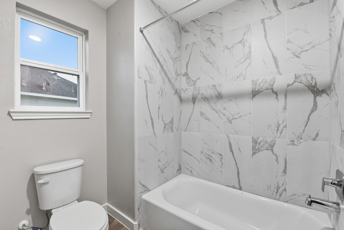 2415 Inlet Court Fresno, TX 77545 - Photo 42 of 50 a white toilet sitting next to a white tub