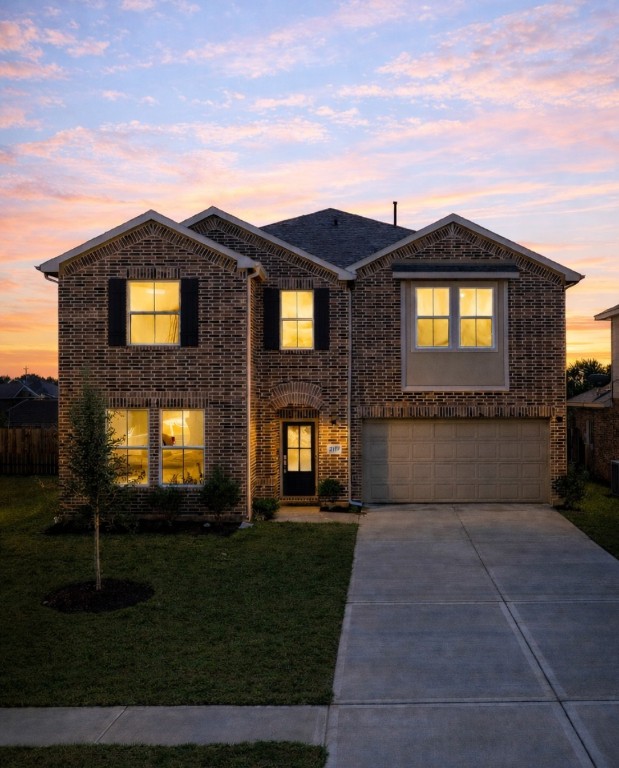 2415 Inlet Court Fresno, TX 77545 - Photo 49 of 50 a front view of a house with a yard and garage