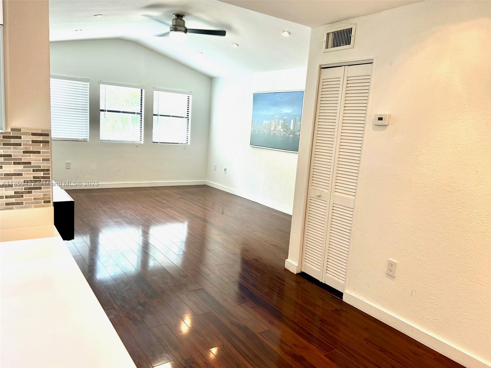 15661 Southwest 104th Terrace, Unit 321 Miami, FL 33196 - Photo 7 of 21 a view of livingroom and hardwood floor