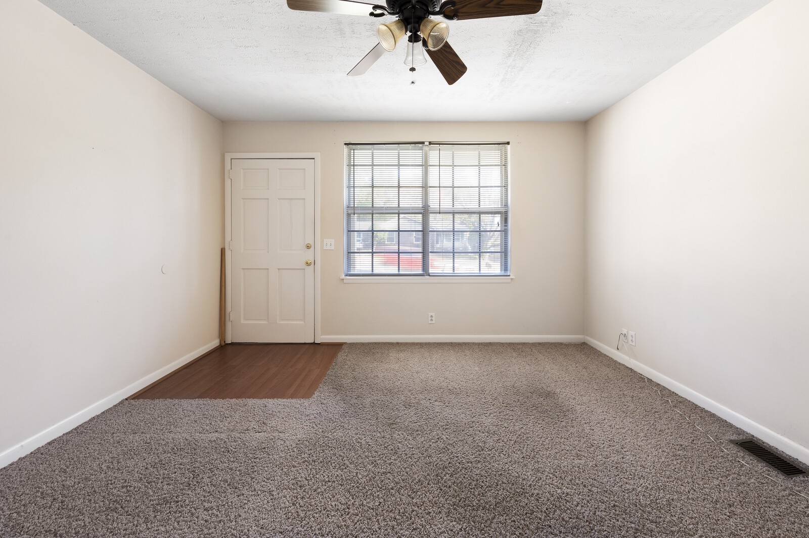 2911 Anderson Road Nashville, TN 37217 - Photo 2 of 14 an empty room with a ceiling fan and windows