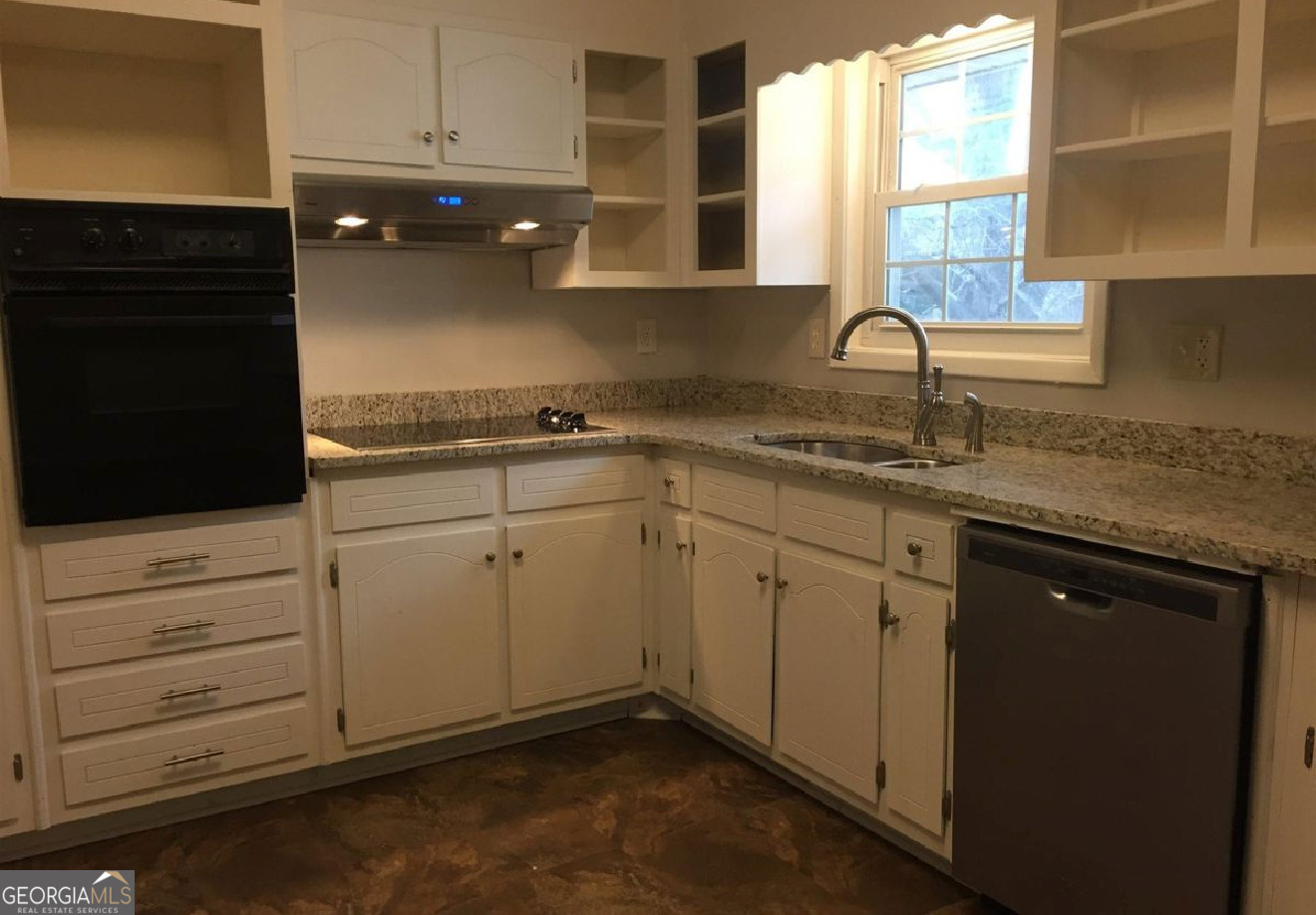 1482 Red Briar Way Jonesboro, GA 30236 - Photo 6 of 7 a kitchen with granite countertop cabinets and window