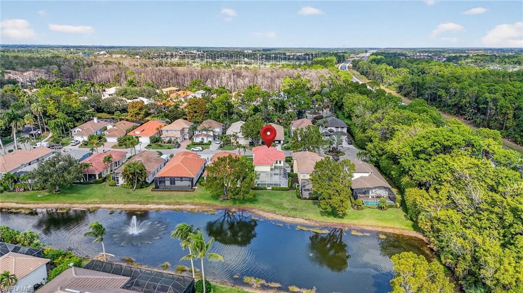 5012 Fairhaven Lane Naples, FL 34109 - Photo 6 of 28 an aerial view of lake and residential houses with outdoor space