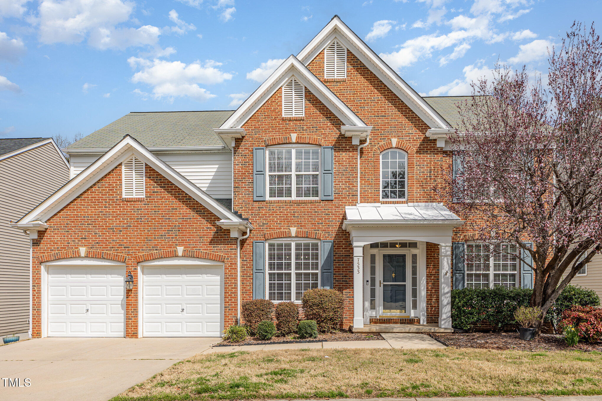 7533 Silver View Lane Raleigh, NC 27613 - Photo 1 of 25 a front view of a house with a yard