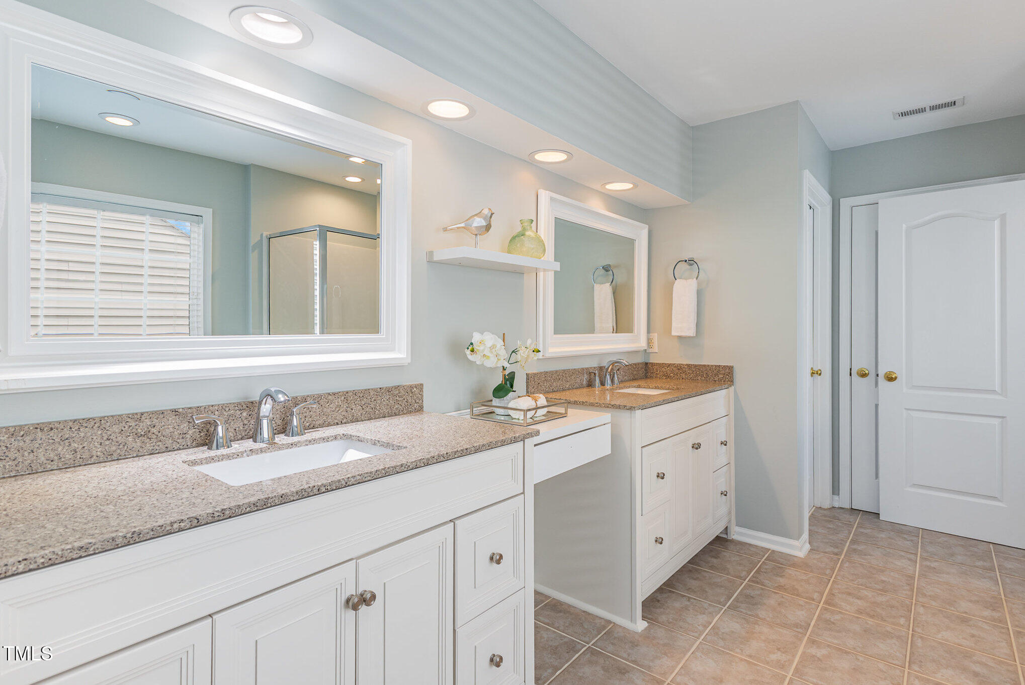 7533 Silver View Lane Raleigh, NC 27613 - Photo 14 of 25 a bathroom with a granite countertop sink mirror and double