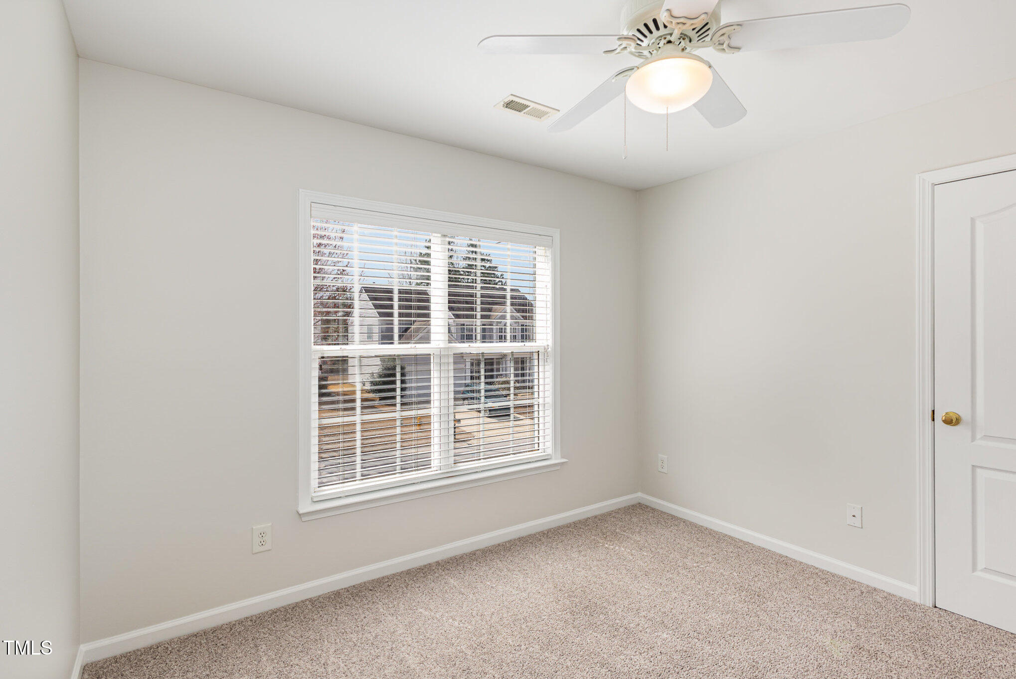7533 Silver View Lane Raleigh, NC 27613 - Photo 16 of 25 an empty room with a window