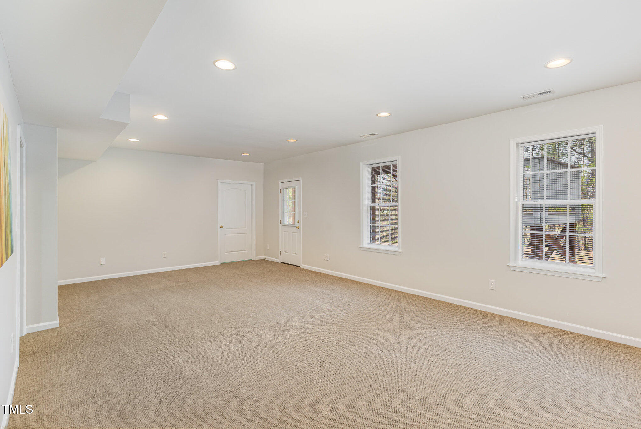 7533 Silver View Lane Raleigh, NC 27613 - Photo 19 of 25 an empty room with windows
