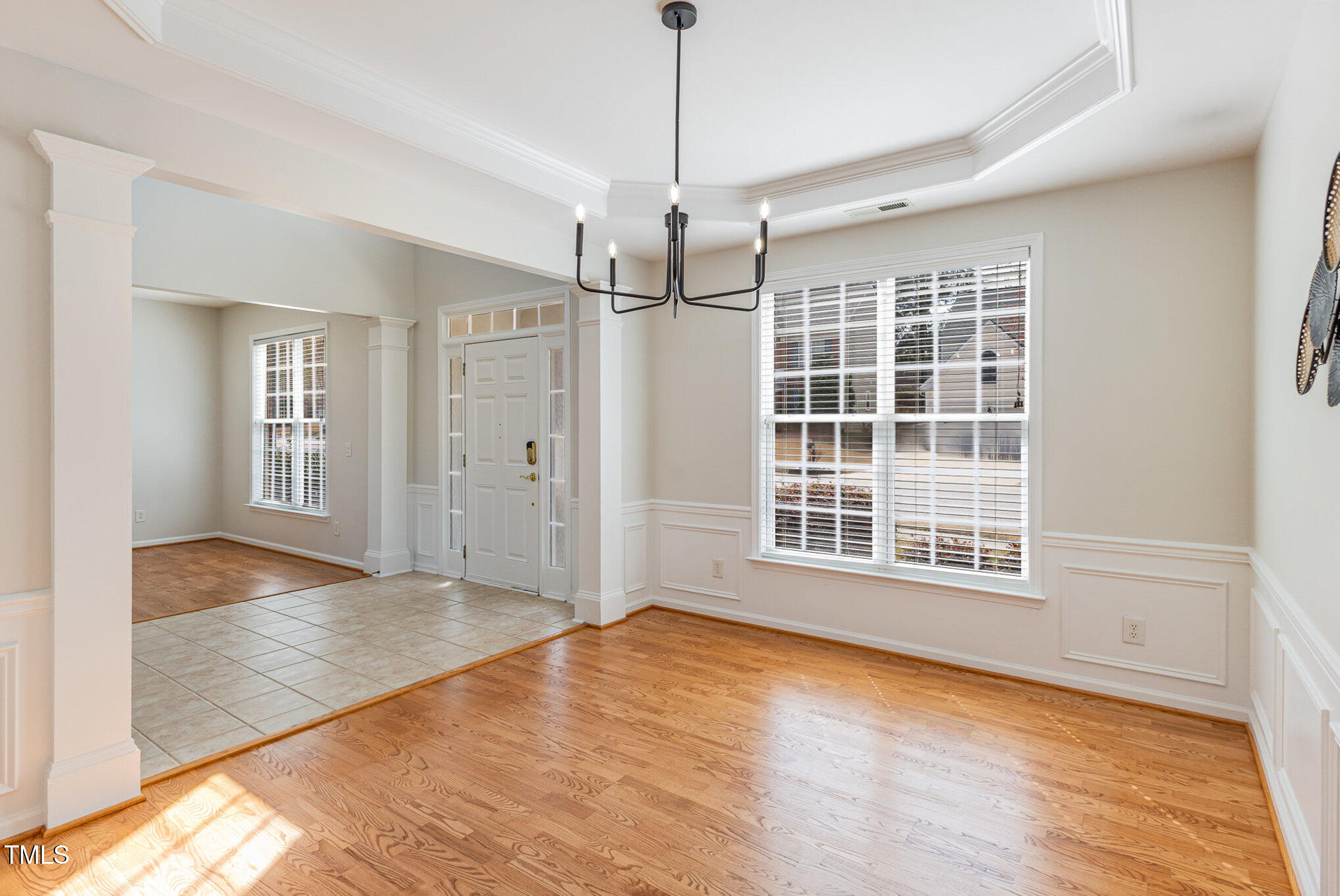 7533 Silver View Lane Raleigh, NC 27613 - Photo 2 of 25 a view of an empty room with a window and wooden floor