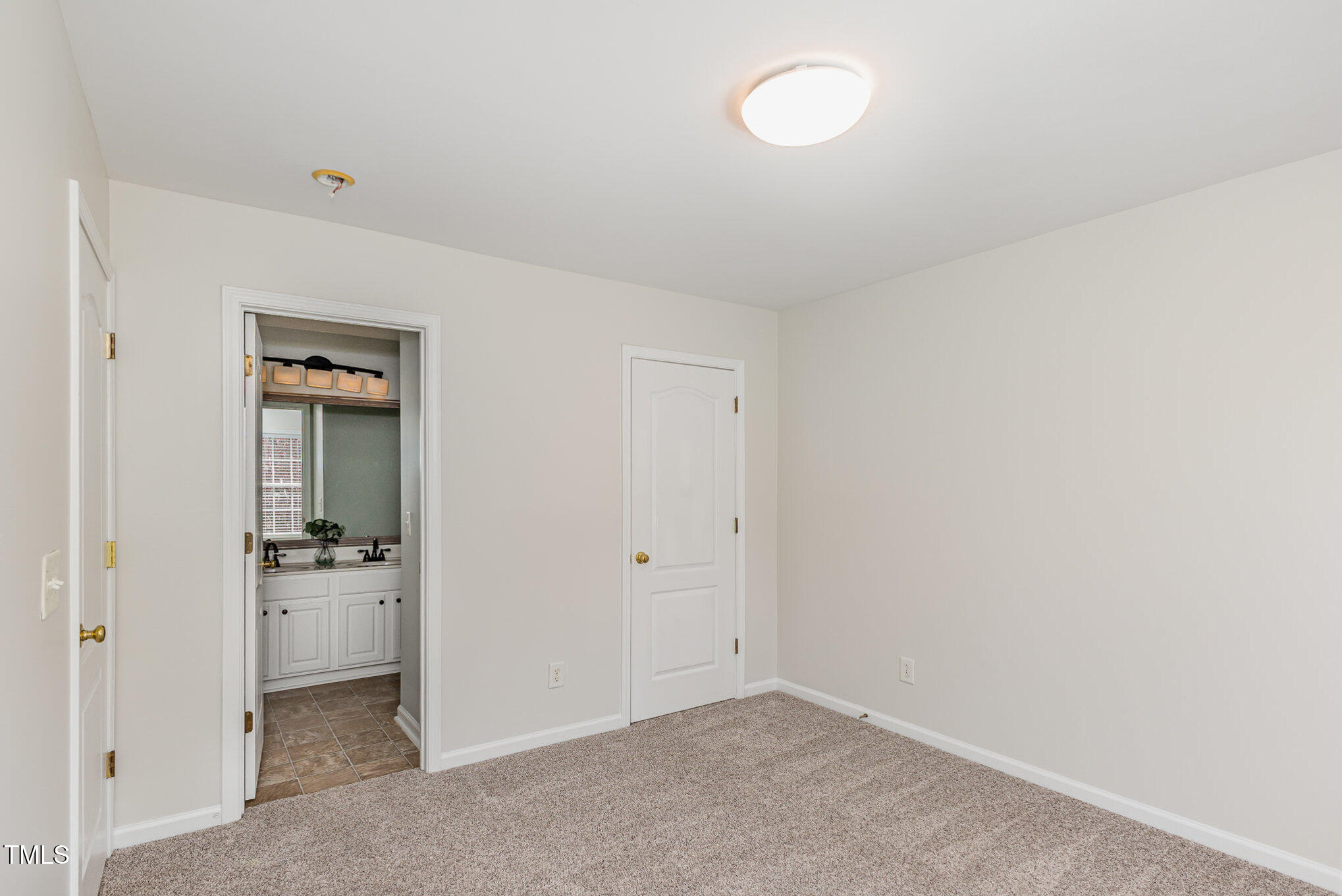 7533 Silver View Lane Raleigh, NC 27613 - Photo 22 of 25 an empty room with closet