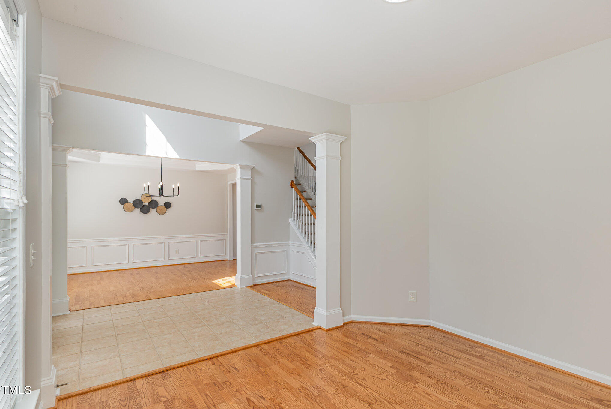 7533 Silver View Lane Raleigh, NC 27613 - Photo 3 of 25 a view of a hallway with wooden floor and a bathroom